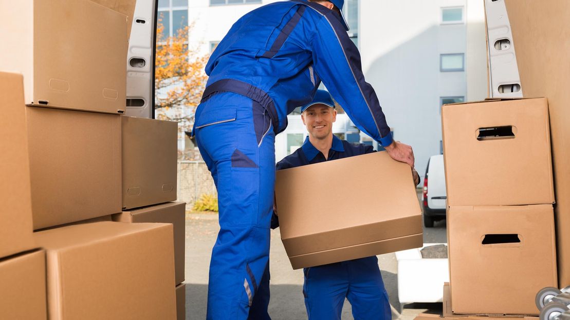 boxes of scrap being loaded onto a van